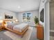 Inviting main bedroom boasting soft carpet, a large window, and neutral decor, perfect for relaxation at 3124 Sharon Cir, Brownsburg, IN 46112