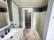 Updated bathroom vanity with a shower/tub combination and tiled flooring at 316 W 6Th St, Anderson, IN 46016