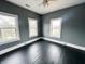 Bedroom featuring refinished floors, large windows, and a ceiling fan at 316 W 6Th St, Anderson, IN 46016