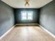 Cozy bedroom with neutral tile floors, natural light, and neutral gray painted walls at 316 W 6Th St, Anderson, IN 46016