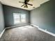 Bedroom featuring neutral carpet, natural light, and neutral gray painted walls at 316 W 6Th St, Anderson, IN 46016