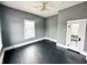Spacious bedroom featuring hardwood floors, neutral paint, and natural light from a large window at 316 W 6Th St, Anderson, IN 46016