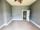 Spacious bedroom with plush carpet, neutral paint, and a ceiling fan at 316 W 6Th St, Anderson, IN 46016