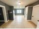 Open dining room featuring neutral tile floors and classic trim throughout the space at 316 W 6Th St, Anderson, IN 46016