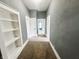 Hallway with plush carpet, neutral paint, and plenty of natural light at 316 W 6Th St, Anderson, IN 46016