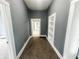 Hallway with plush carpet, neutral paint, and built-in shelving at 316 W 6Th St, Anderson, IN 46016