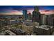 Striking sunset view of downtown featuring modern skyscrapers and buildings with vibrant skyline in the background at 350 N Meridian St # 610, Indianapolis, IN 46204