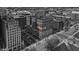 Bird's-eye view of a historic brick building with surrounding cityscape and parking at 350 N Meridian St # 610, Indianapolis, IN 46204