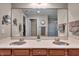 Bathroom featuring dual vanity sinks and access to walk-in closet at 350 N Meridian St # 610, Indianapolis, IN 46204