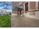 Elegant building entrance with a covered canopy, manicured bushes, and convenient street access at 350 N Meridian St # 610, Indianapolis, IN 46204