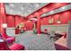Red-themed dining area with comfortable seating, elegant lighting, and stylish decor at 350 N Meridian St # 610, Indianapolis, IN 46204