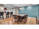 Modern dining room with hardwood floors, stylish lighting, and bar seating in the background at 350 N Meridian St # 610, Indianapolis, IN 46204