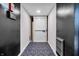Hallway with a carpeted floor, neutral paint and elevator access for accessibility throughout the building at 350 N Meridian St # 610, Indianapolis, IN 46204