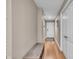 Hallway featuring hardwood floors, neutral walls, and white doors to rooms at 350 N Meridian St # 610, Indianapolis, IN 46204