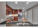 Well-lit kitchen featuring stainless steel appliances, granite countertops, and hardwood floors at 350 N Meridian St # 610, Indianapolis, IN 46204