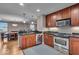 Eat-in kitchen featuring stainless steel appliances, hardwood floors, and granite countertops at 350 N Meridian St # 610, Indianapolis, IN 46204