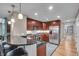 Well-lit kitchen featuring stainless steel appliances, granite countertops, and pendant lighting at 350 N Meridian St # 610, Indianapolis, IN 46204