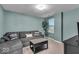 Comfortable living room with a gray sectional sofa, tree accent, and a coffee table with a drawer at 350 N Meridian St # 610, Indianapolis, IN 46204