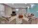 Inviting living room with neutral tones, hardwood floors, and ample natural light from large windows at 350 N Meridian St # 610, Indianapolis, IN 46204