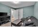 Cozy living room with blue walls, comfortable seating, and ample natural light at 350 N Meridian St # 610, Indianapolis, IN 46204