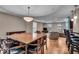 Open concept living space with hardwood floors, dining table, and a living room area at 350 N Meridian St # 610, Indianapolis, IN 46204