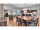 Spacious open-concept living space with hardwood floors, a dining area, and a kitchen at 350 N Meridian St # 610, Indianapolis, IN 46204