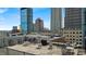 Rooftop terrace featuring comfortable seating and stunning city views with clear blue skies at 350 N Meridian St # 610, Indianapolis, IN 46204