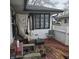 A home's back patio with a BBQ, chair, and seating at 3701 N Audubon Rd, Indianapolis, IN 46218