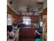 Functional kitchen with a ceiling fan, ample cabinet space, and a bright window view at 3701 N Audubon Rd, Indianapolis, IN 46218