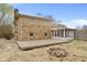 Exterior of home featuring stone detail, a large driveway, and backyard at 4108 Carson Ave, Indianapolis, IN 46227