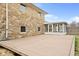 Spacious backyard featuring a large wood deck and stone exterior at 4108 Carson Ave, Indianapolis, IN 46227