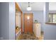 Inviting foyer with stylish tile flooring and a convenient built-in bench and storage at 4108 Carson Ave, Indianapolis, IN 46227