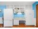 Kitchen includes white refrigerator, white cabinets, granite countertops, and built-in shelving at 4108 Carson Ave, Indianapolis, IN 46227