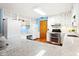 This updated kitchen features granite countertops, stainless steel appliances, and plenty of storage space at 4108 Carson Ave, Indianapolis, IN 46227
