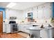 Charming kitchen featuring white cabinets, stainless steel appliances, and granite countertops with backsplash at 4108 Carson Ave, Indianapolis, IN 46227