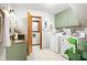 Laundry room with a sink and cabinet, as well as a washer and dryer at 4108 Carson Ave, Indianapolis, IN 46227