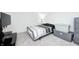 Cozy bedroom featuring a single bed with soft carpet, complemented by storage bins at 4135 Benicia Ln, Indianapolis, IN 46235