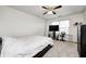 Light-filled bedroom featuring a ceiling fan, and comfortable bed with a TV for relaxing entertainment at 4135 Benicia Ln, Indianapolis, IN 46235