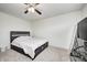 Cozy bedroom with large bed, ceiling fan and TV stand at 4135 Benicia Ln, Indianapolis, IN 46235