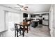 Eat-in kitchen featuring dark wood cabinets, stainless steel appliances, and a sliding glass door at 4135 Benicia Ln, Indianapolis, IN 46235
