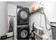Modern laundry room with stacked Samsung washer and dryer, plus storage at 4135 Benicia Ln, Indianapolis, IN 46235