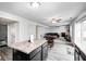 Spacious open concept living area with kitchen island, dining space and comfortable lounge at 4135 Benicia Ln, Indianapolis, IN 46235