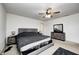 Bright Primary bedroom with ceiling fan, large bed and dresser at 4135 Benicia Ln, Indianapolis, IN 46235