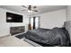 Bright Primary bedroom with ceiling fan and large dresser at 4135 Benicia Ln, Indianapolis, IN 46235