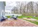 Charming brick patio featuring comfortable seating and a cozy fire pit, perfect for outdoor relaxation and entertaining at 4135 Benicia Ln, Indianapolis, IN 46235