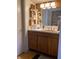 Bathroom with wood vanity, sink, and decorative shelving at 4214 Woodsage Trce, Indianapolis, IN 46237