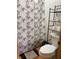Bathroom with shower, toilet, and shelving unit at 4214 Woodsage Trce, Indianapolis, IN 46237