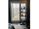 Bedroom with large window and shelf filled with plants at 4214 Woodsage Trce, Indianapolis, IN 46237