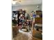 Chaotic room with shelves of supplies, storage boxes, and various miscellaneous items, lit by a ceiling fan at 4214 Woodsage Trce, Indianapolis, IN 46237