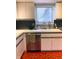 Bright kitchen with white cabinets, stainless steel dishwasher, and sink under a window at 4214 Woodsage Trce, Indianapolis, IN 46237